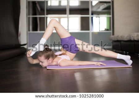 little caucasian girl engaged in aerobics