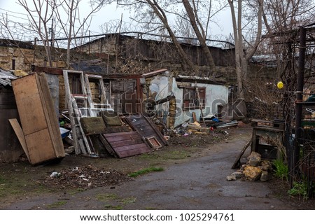 Houses in a poor neighborhood where poor people live. Destruction of old houses, earthquakes, economic crisis, abandoned houses. Broken unfit house. Odessa, Ukraine, 2018
