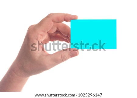 left hand holds blank cyan business card - isolated on white background with copyspace