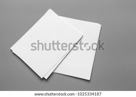 Mock up white paper on gray background.