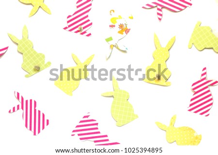Easter bunny (Easter rabbit) craft of paper, isolated on white background. Festive decor of handmade. Pattern.