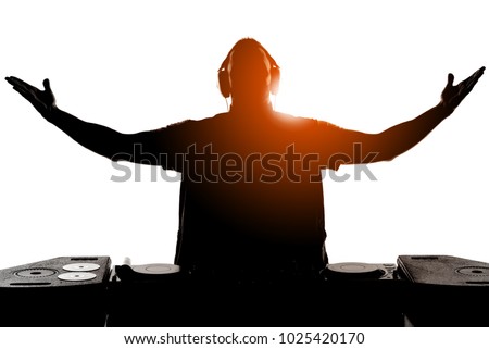 DJ silhouette. Silhouette of DJ gesturing and spinning on turntable Royalty-Free Stock Photo #1025420170