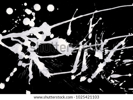 Isolated artistic white watercolor and ink paint splatter textures and decorative elements on black wall background.