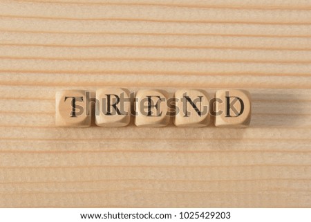 Trend word on wooden cubes. Trend concept