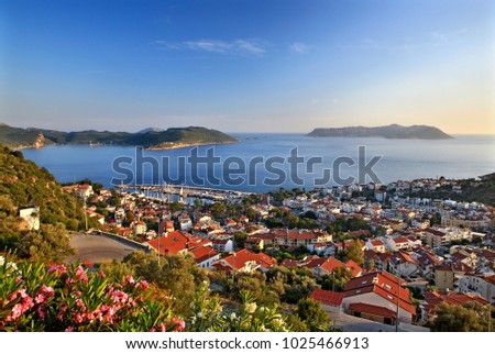 LYCIA, TURKEY. The picturesque town of Kas (ancient name "Antiphellos"), Antalya province. In the background to the right, the tiny Greek island of Kastellorizo (also known as "Meghisti")