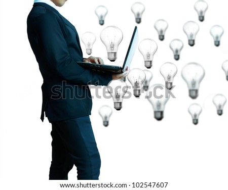 business man with laptop ands Light bulbs isolated on white background
