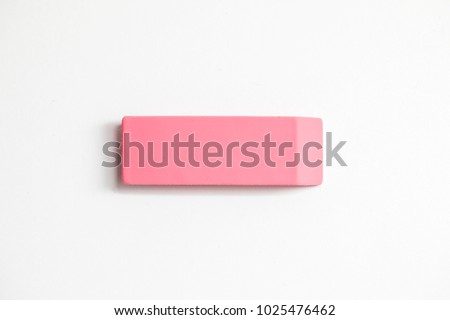 Pink eraser shot up close against a white background Royalty-Free Stock Photo #1025476462