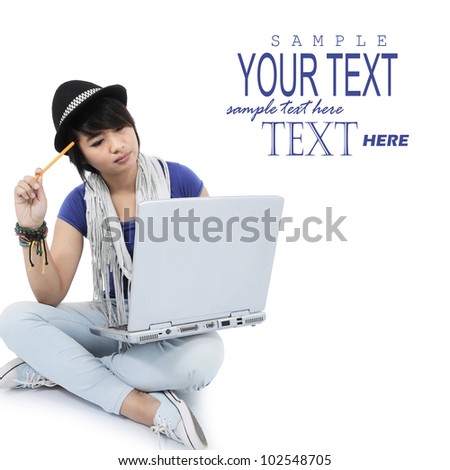 portrait of a young woman using laptop with her hand holding a pencil, isolated on white background