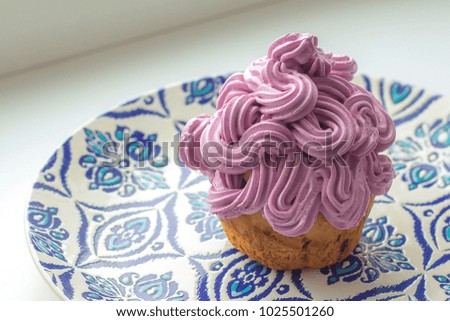 fruitcake with berry lilac cream