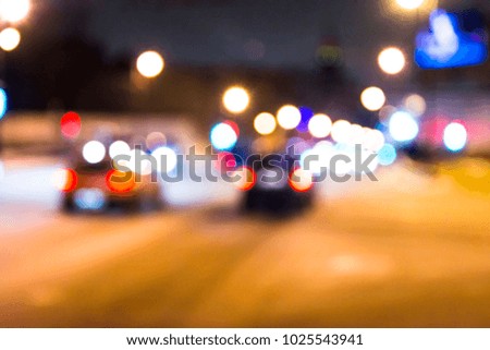 Blurred Photo, cityscape at twilight time, Traffic lights of the night city road.