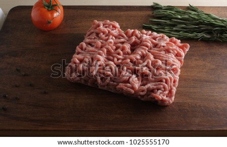 minced beef pork meat on a wooden background
