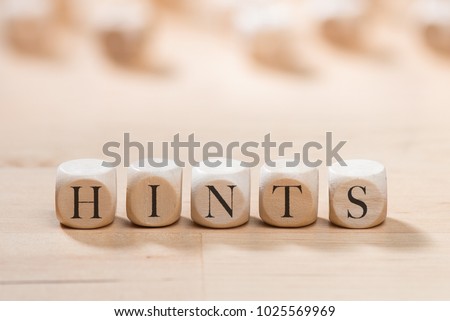 Hints word on wooden cubes. Hints concept Royalty-Free Stock Photo #1025569969
