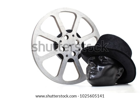 film reel of old movies and black dummy head had on white background.concept cinema