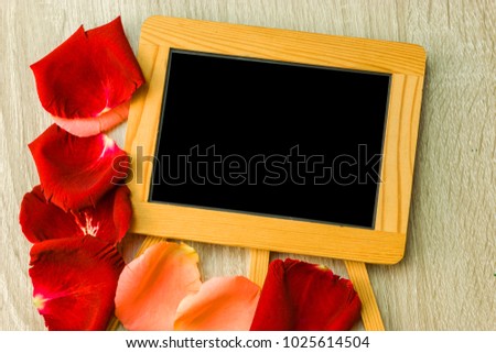 red roses petals and blank paper for valentine concept