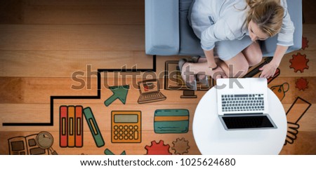 Woman on her laptop against wooden floor