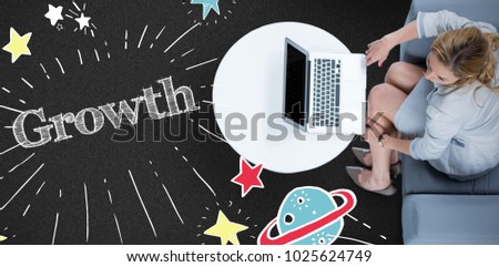 Woman on her laptop against black background