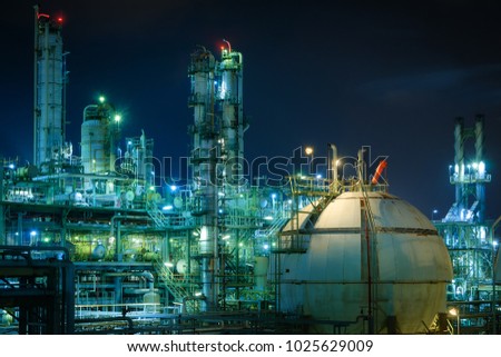 Gas storage sphere tank in gas and oil refinery plant with night, Close up of petrochemical plant, Glitter lighting of industrial plant Royalty-Free Stock Photo #1025629009