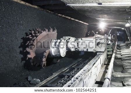 Coal mine excavator underground Royalty-Free Stock Photo #102564251