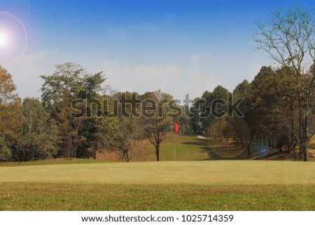 Background evening golf course has sunlight shining down at golf course in Thailand