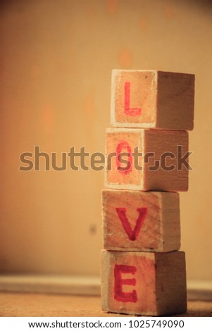 wooden blocks with LOVE word with background, Valentine's concept