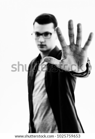 man doing a number five with fingers
