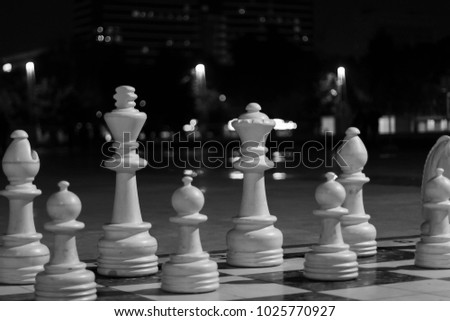 Chessmen against the background of the beautiful night Baku boulevard