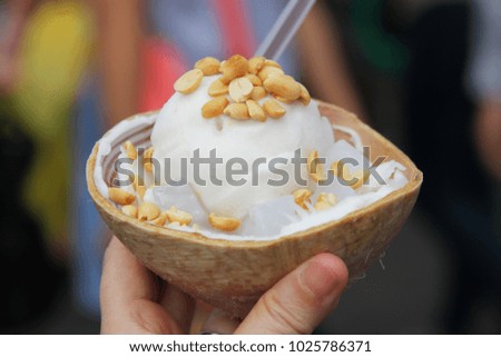Closeup coconut ice cream in the coconut shell with nuts