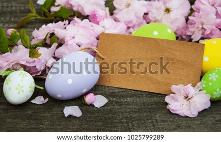 Easter eggs, spring sakura blossom and greeting card