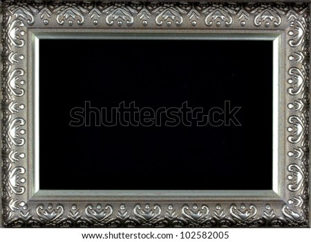 Antique silver and patterned picture frame black background