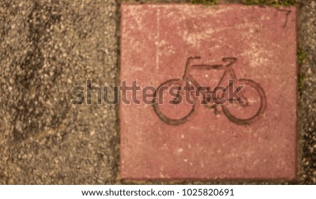 Bicycle road sign on asphalt blur