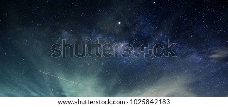 transverse milky way in cloudy sky with .
