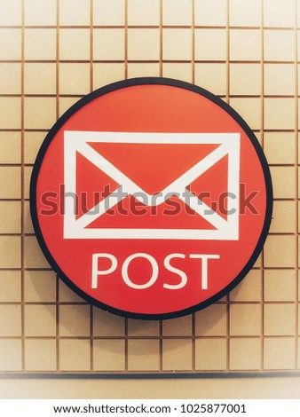 An illuminated envelope logo of post office