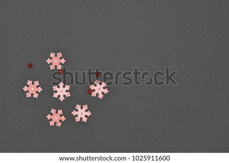 Wood snowflakes on dark background