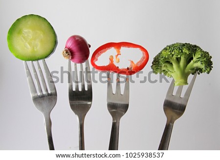 vegetables on a fork with white background stock photo