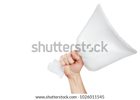 Hand holding inflated empty packet, isolated on white background