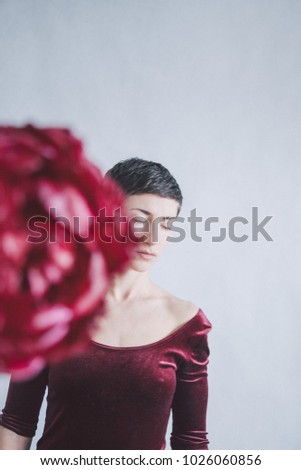 short-cut girl in burgundy dress with peony