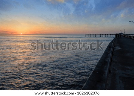 The sunset over the Ocean Beach Pier near San Diego, California.