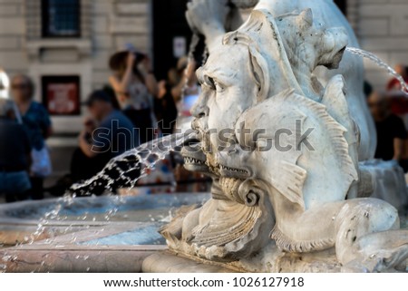 particular of the fountain del Moro, It represents a Moor standing in a conch shell, wrestling with a dolphin, by Gian Lorenzo Bernini in 1653. Situated in Navona square in Rome