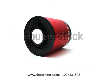Portable speaker or
wireless speaker or mini-column red color, isolated on white background.