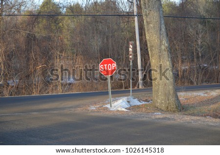 A stop sign on a country road