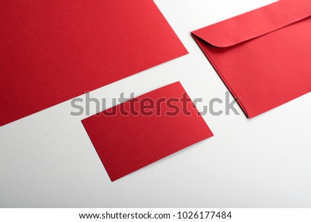 Business card, envelope and red sheet.. Copy space. Mockup.