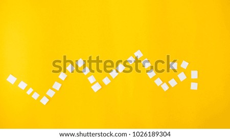 graph arrow paper cut yellow background