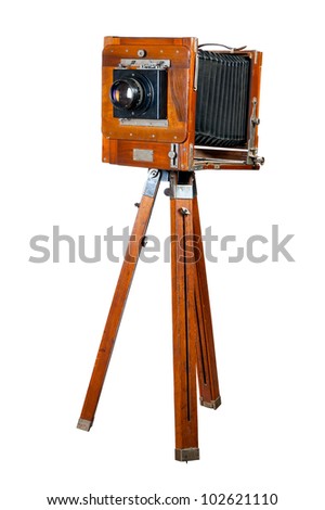 Ancient wooden camera. It is isolated on a white background