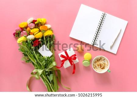 Festive morning concept buttercup flowers bouquet, gift box, cup of cappuccino, cake on the pink background.