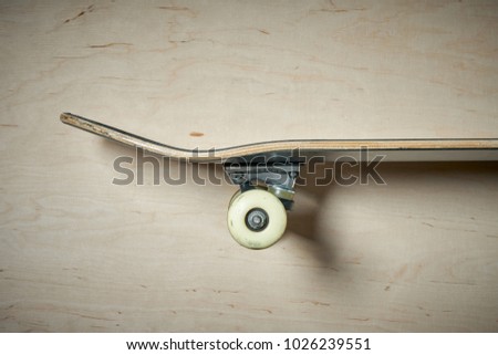 top view aside of skateboard on a wooden background