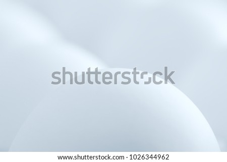 Single white egg isolated on the white background of other eggs. Gorgeous white egg in extreme macro key. Extraordinary form eggs. Easter and holiday conceptual photo. Social media concept.