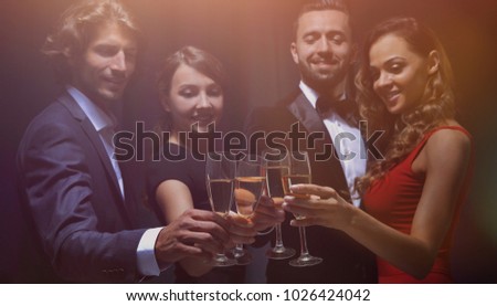 Group of happy smiling friends with glasses
