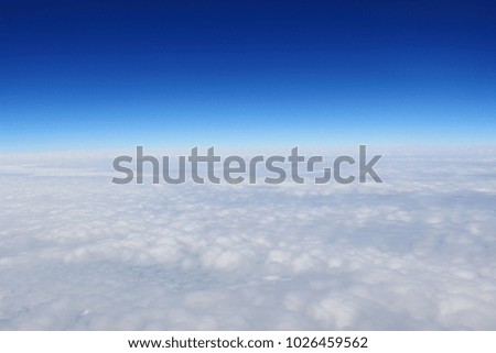  view from the window of an airplane flying in the clouds.