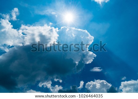 White cloud and blue sky with the sun and sun beam
