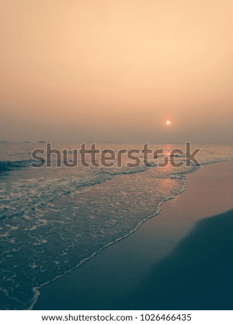 sunset on the beach Royalty-Free Stock Photo #1026466435